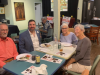 FLVCS member, Philippe, sitting with Matthew Hoh and two guests at the 2022 Tom Paine Party.