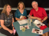 Three guests, Laurel, Lynn, and Larry sitting at a table.