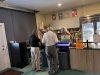 Guests standing in line getting refreshments.