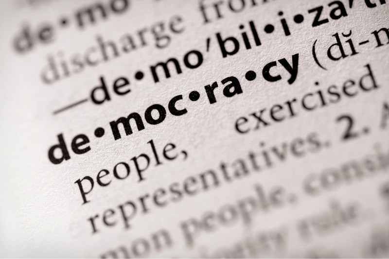 Picture of dictionary with definition of democracy highlighted.