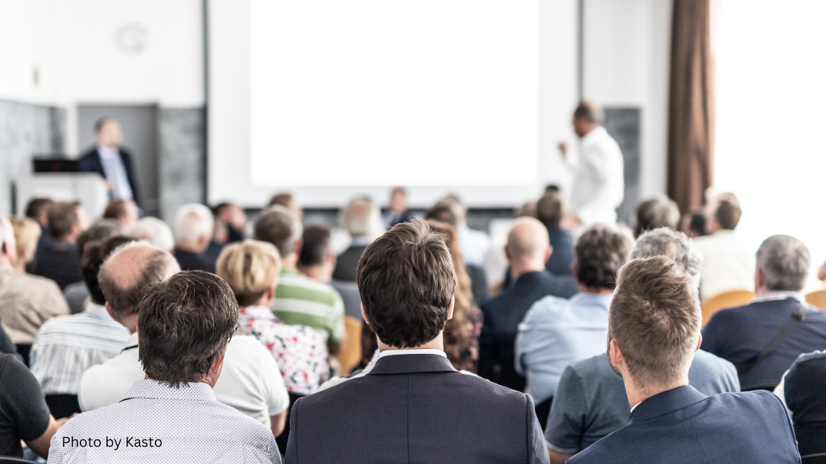 Person standing up in a meeting asking a question. The FLVCS monthly meeting has been rescheduled. Photo by Kasto.