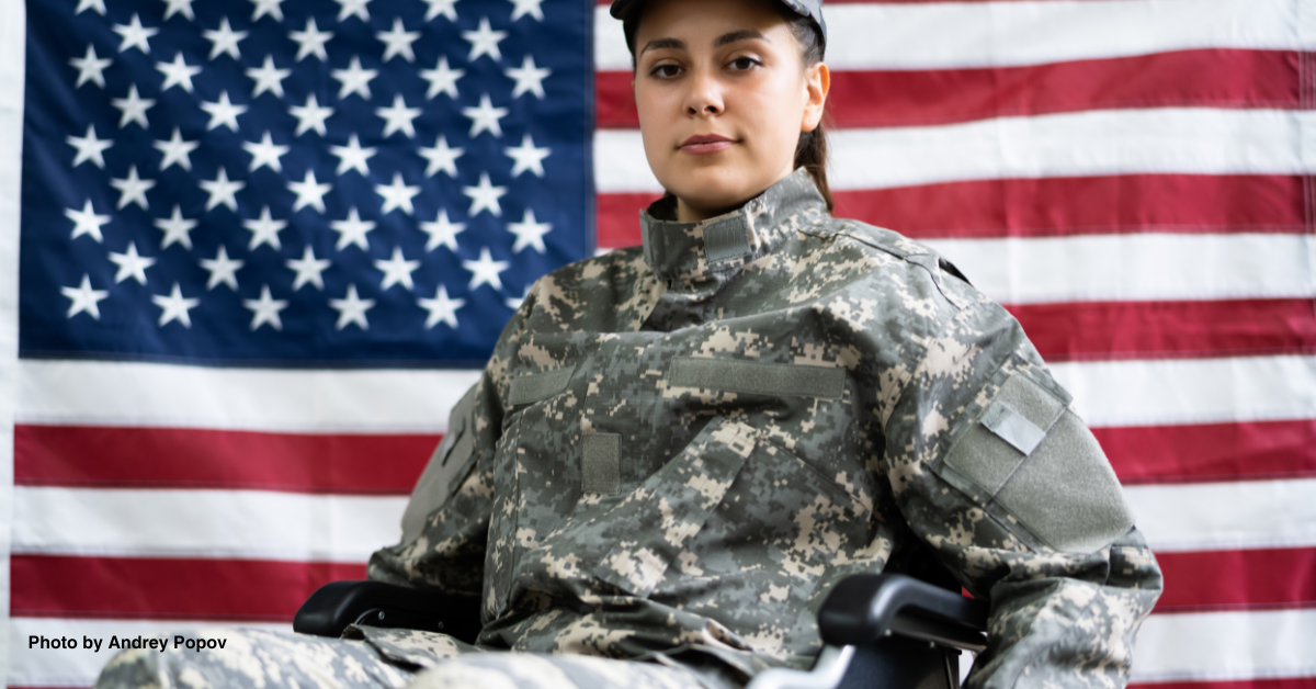 Patriotic female veteran in wheelchair. Planning on attending one of the five Veterans Services' annual meetings in Manatee County.
