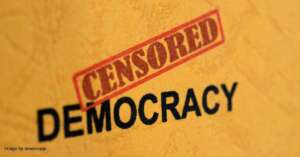 Censored - Democracy text on an orange background